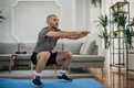 man exercising at home man exercising at home