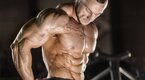 Muscular bodybuilder showing his shoulder muscles after his delts workout routine Muscular bodybuilder showing his shoulder muscles after his delts workout routine