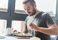 man eating salad man eating salad
