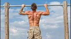 Fit and young army enlistee running doing pullups for the Murph challenge Fit and young army enlistee running doing pullups for the Murph challenge